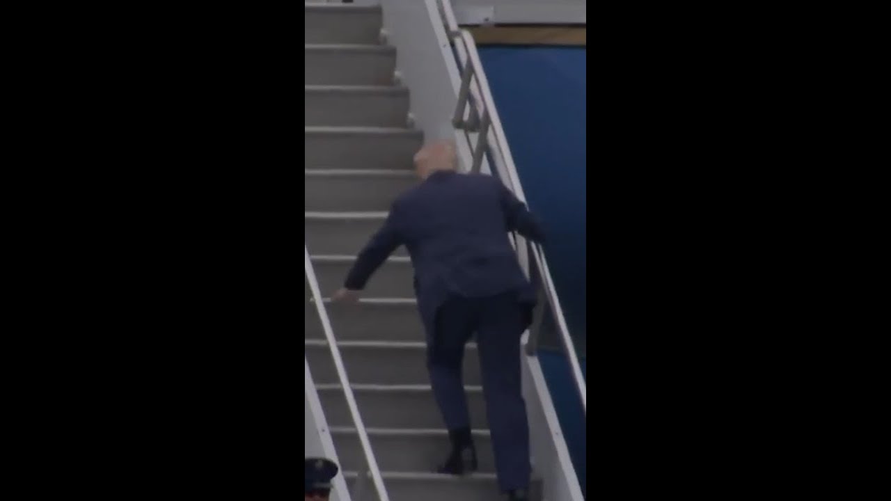 Donald Trump trips while attempting to board Air Force One