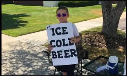 Police are called on boy selling ‘Ice Cold Beer’ but his clever sign has them chuckling
