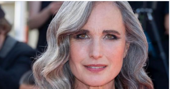 Andie MacDowell struts the streets in a chic casual dress, with her gorgeous silvery hair framing her makeup-free face
