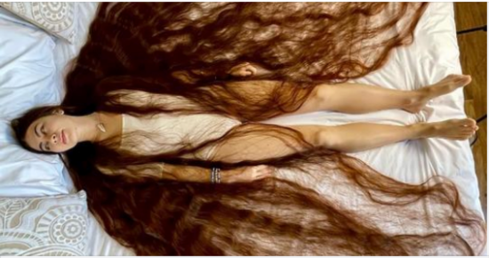 With 90-inches of flowing brown locks, this real life Rapunzel has hair brushing the ground behind her