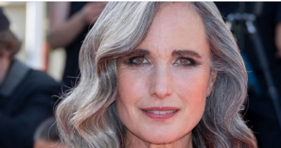 Andie MacDowell struts the streets in a chic casual dress, with her gorgeous silvery hair framing her makeup-free face