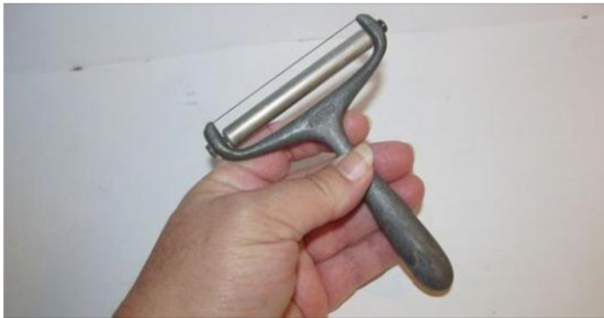 The Mysterious Vintage Cheese Slicer: A Kitchen Time Capsule